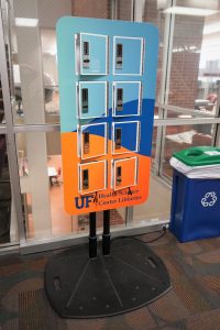 An orange a blue stand with individual lockers