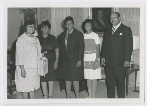 Barbara Jordan standing with her family in the Governor's Mansion for Governor for a Day. From left to right: Arlyne Jordan, Bennie Creswell, Barbara Jordan, Rose Mary McGowan, and John McGowan.