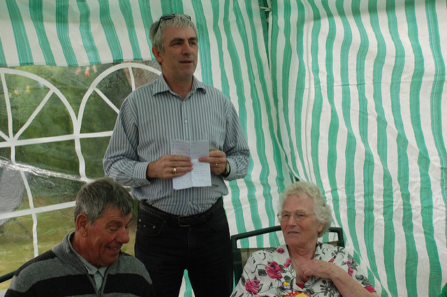 A man giving a birthday speech for his friend