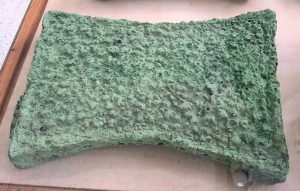 Rectangular with curved sides piece of green oxhide ingot