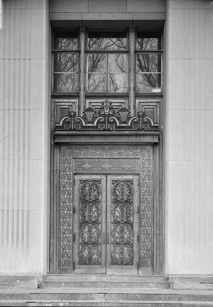 Large, ornate aluminum doors with windows above