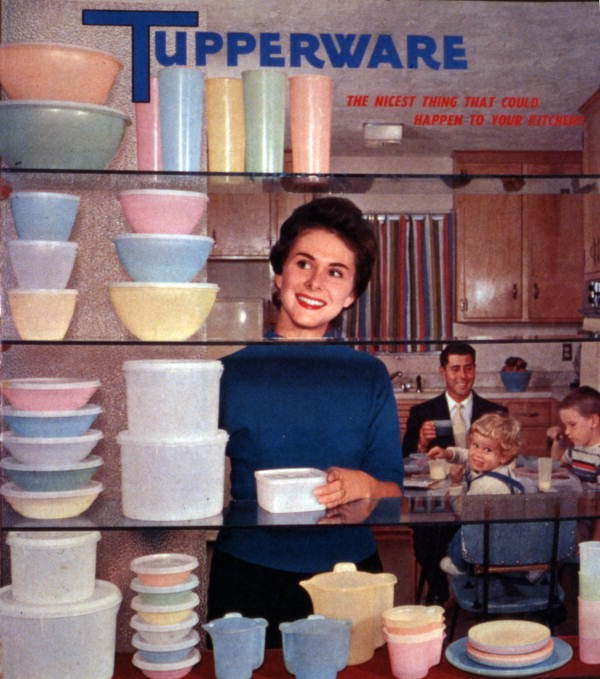Colorful tupperware advertisement with shelves of tupperware and woman smiling with man and two children in the background