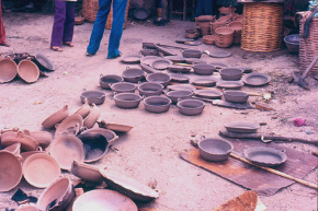 Arrangement of clay bowls scattered on ground