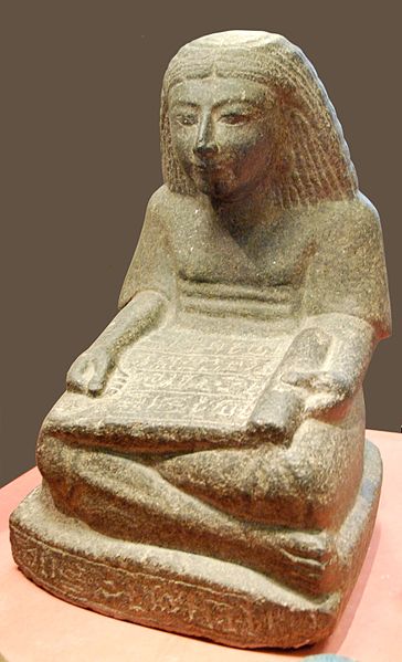 Figure of scribe seated with papyrus scroll in lap