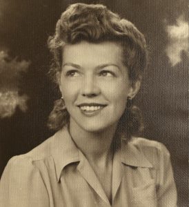 Sepia photograph of Dorothy, who is looking up to the left and smiling.